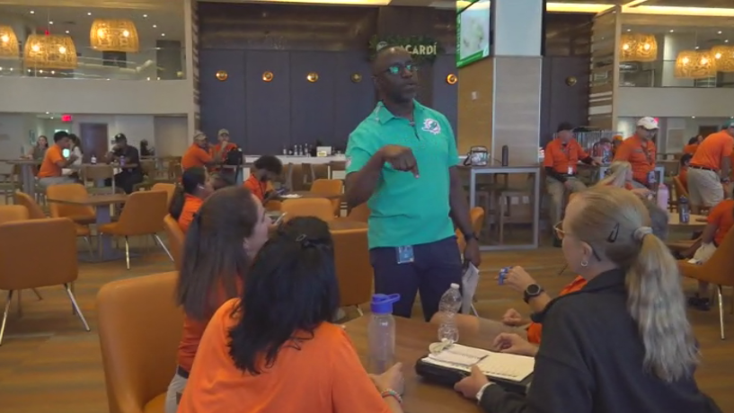 Miami Dade College professor finds his passion with side job at Hard Rock Stadium — CBS Miami, Frisco Arts news